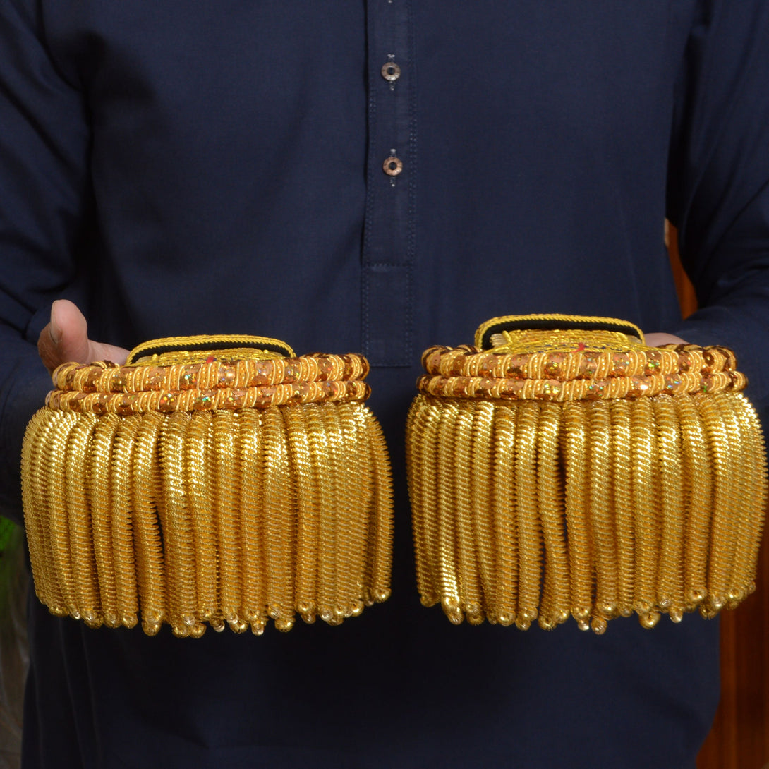 Decorative gold shoulder epaulettes for ceremonial dress